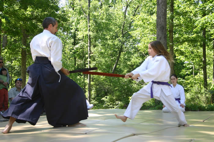Two aikido students with shinai